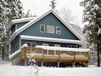 Custom home home with Hardi plank siding, vaulted ceilings built by bavariancottages.com out in Barriere, BC, Canada